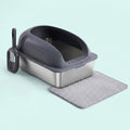 Stainless-steel cat litter box with a dark grey high-sided hood, scoop and litter mat